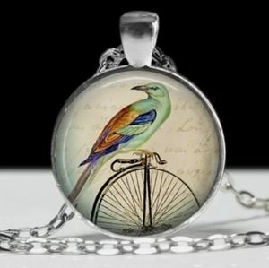 Bird and bicycle pendant